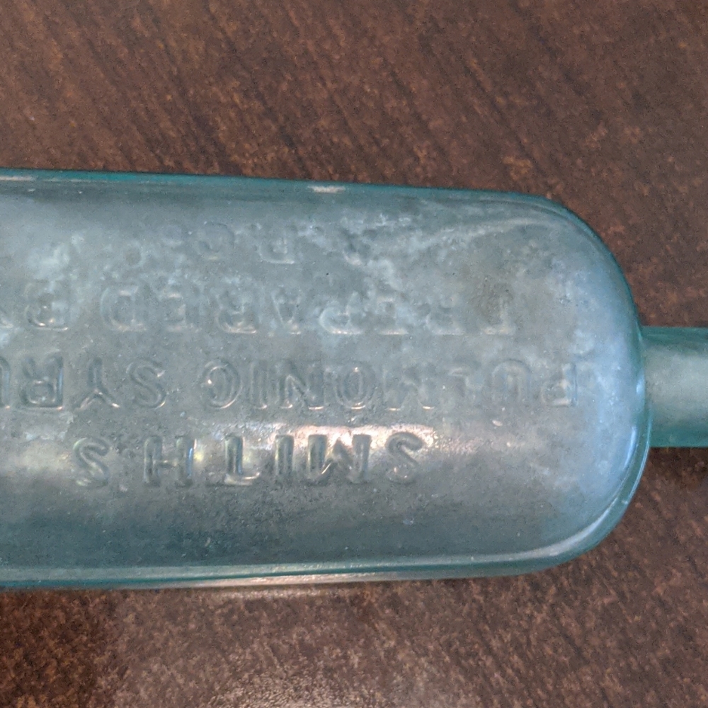 Vintage blue glass bottle (Smiths syrup)